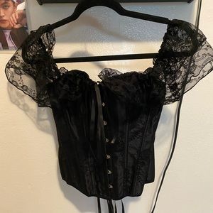 Corset lace up in back hooks and bow in front